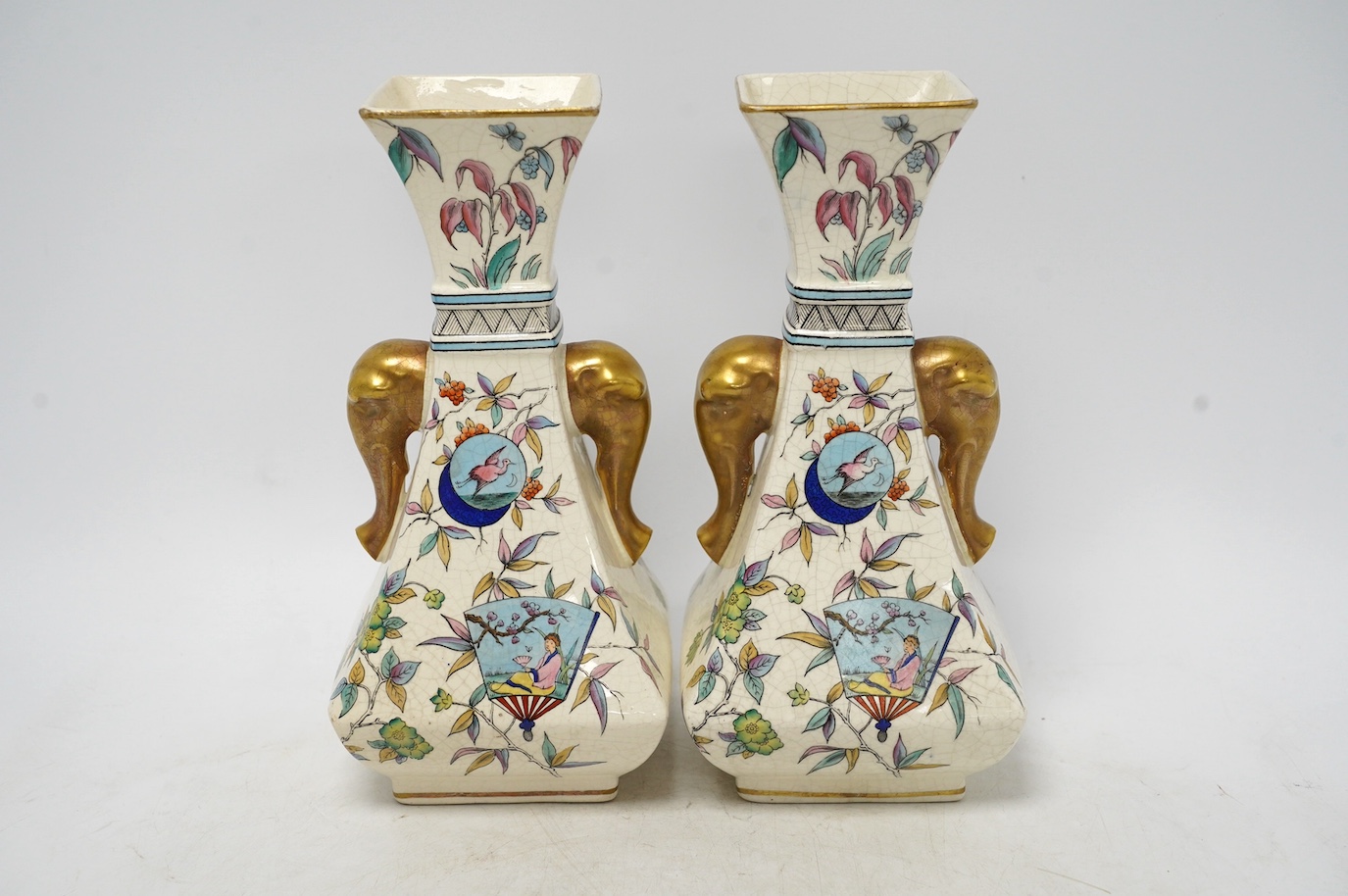 A pair of Christopher Dresser Old Hall crackleware Japanese inspired vases with gilt decorated elephant handles, 24cm high. Condition - good